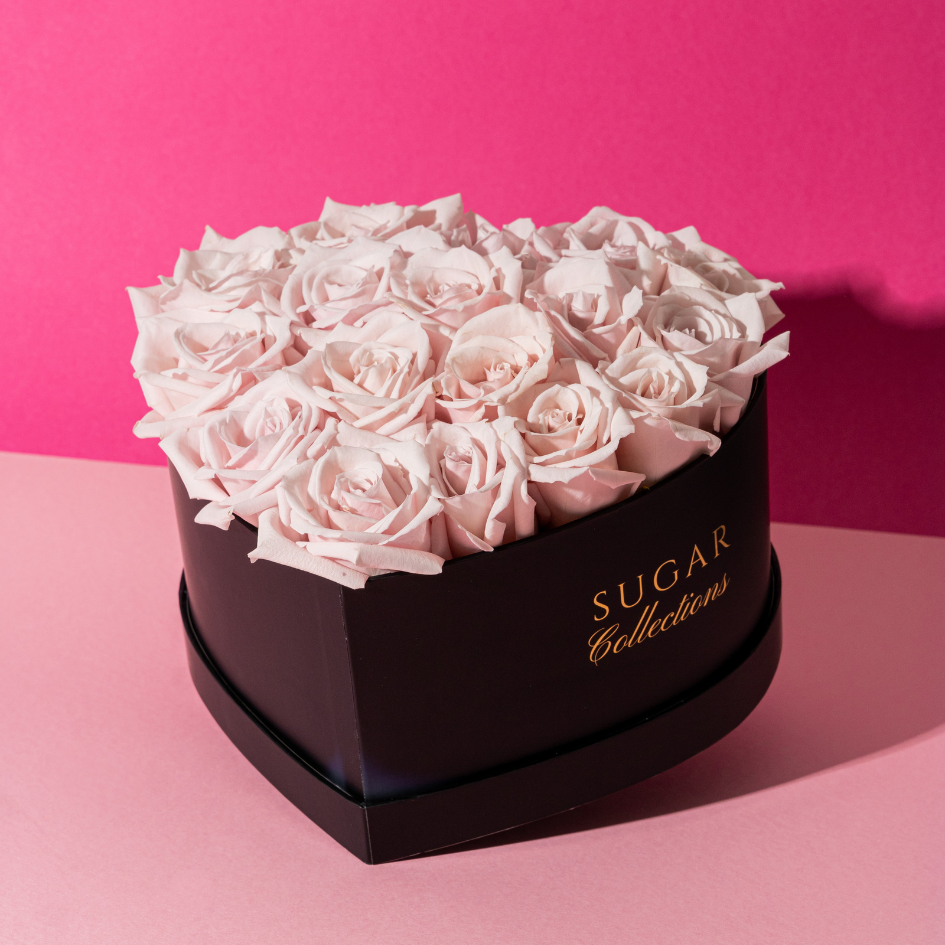 Black heart box with fresh roses